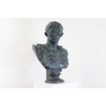 A large bronzed plaster bust,