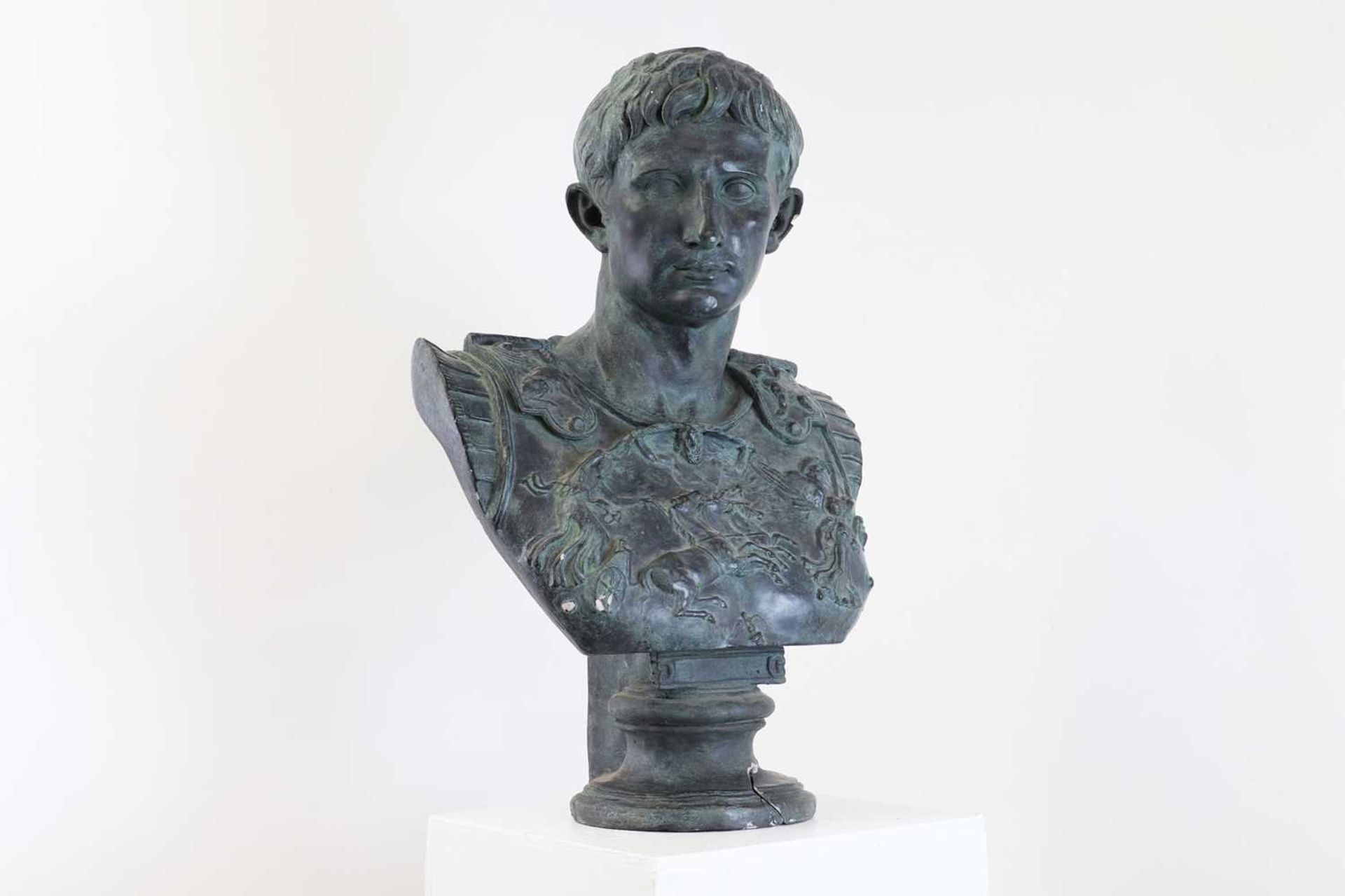 A large bronzed plaster bust,