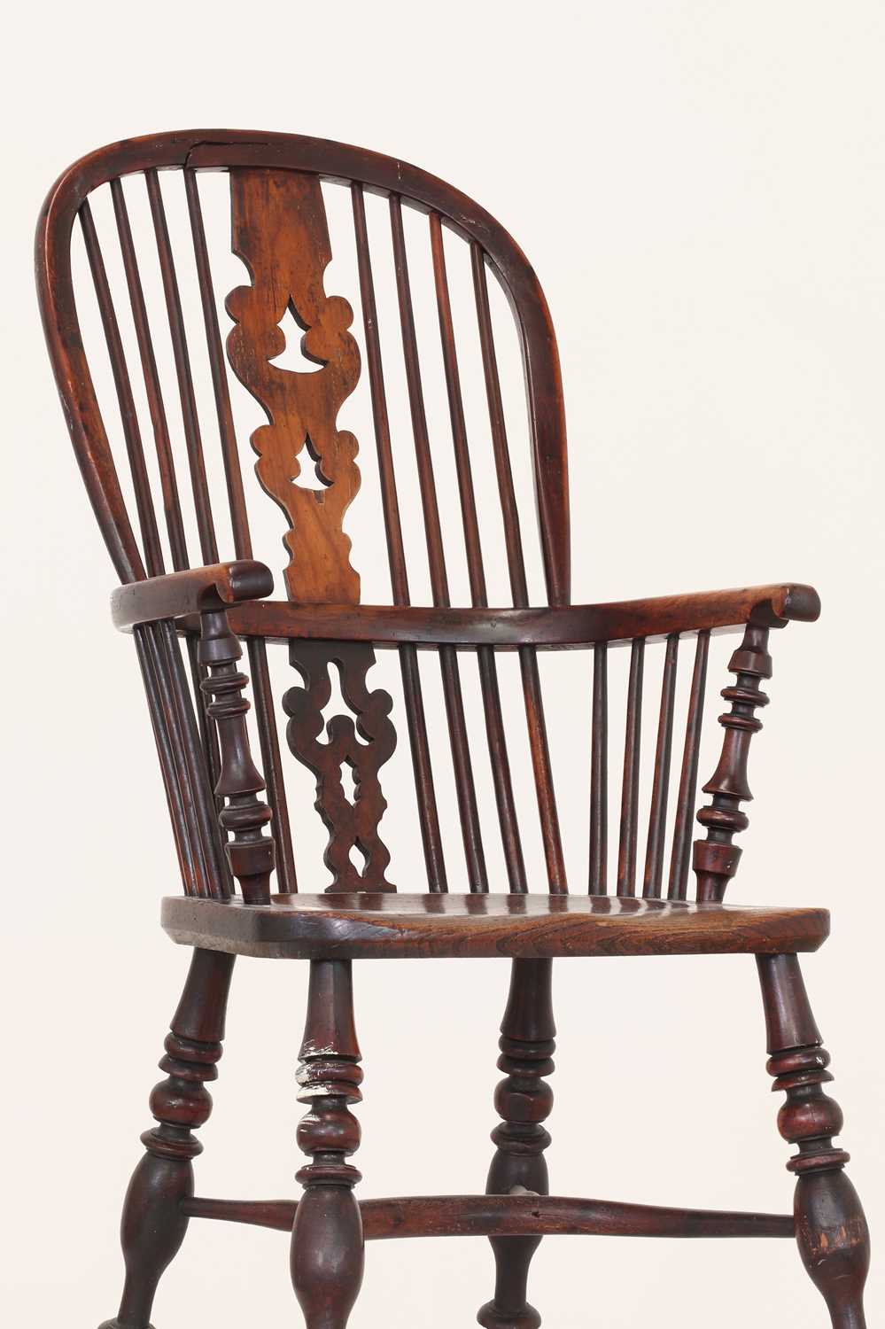A Victorian yew and elm Windsor chair,