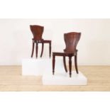 A pair of George IV mahogany hall chairs,