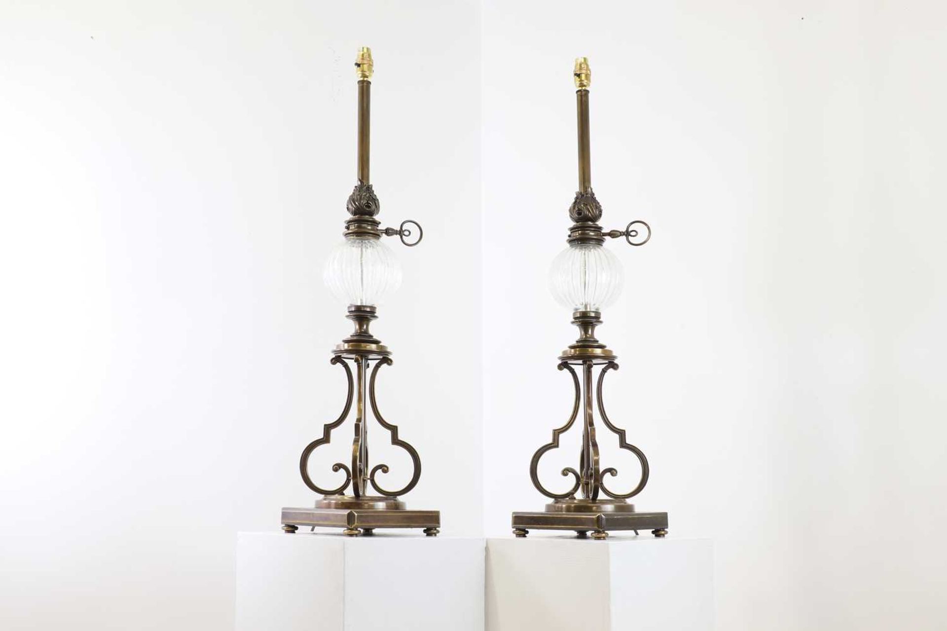 A pair of brass student-style table lamps,