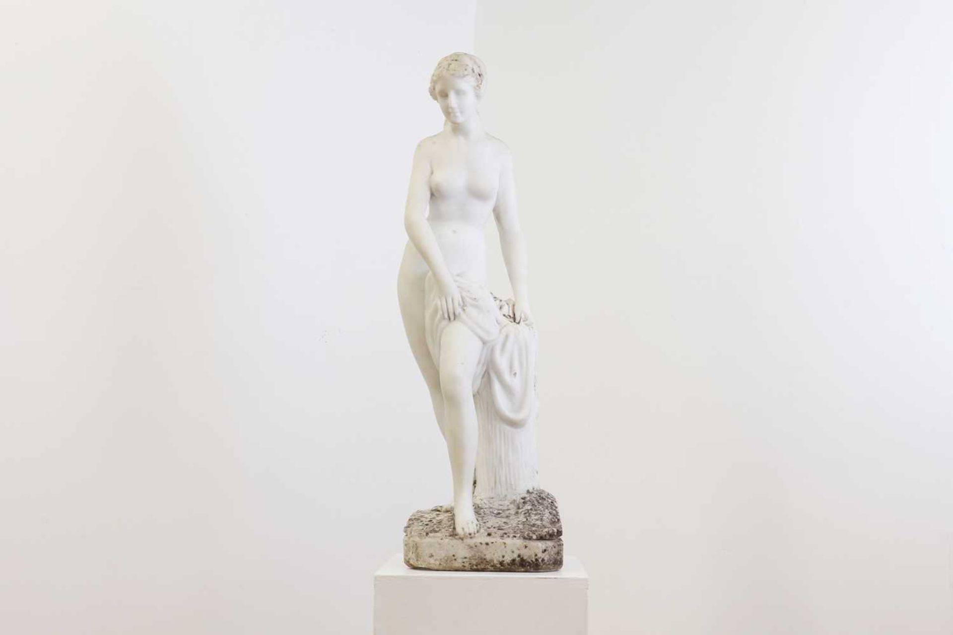 A weathered marble figure,
