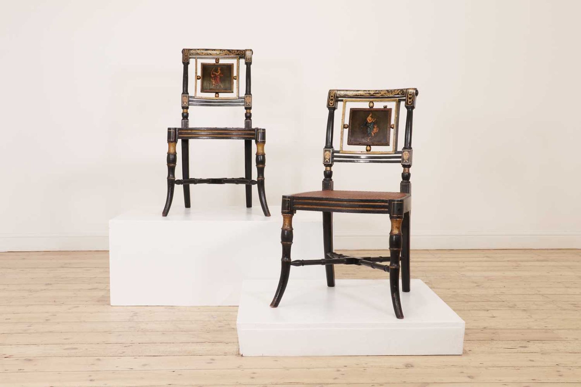 A pair of George III painted wooden side chairs,