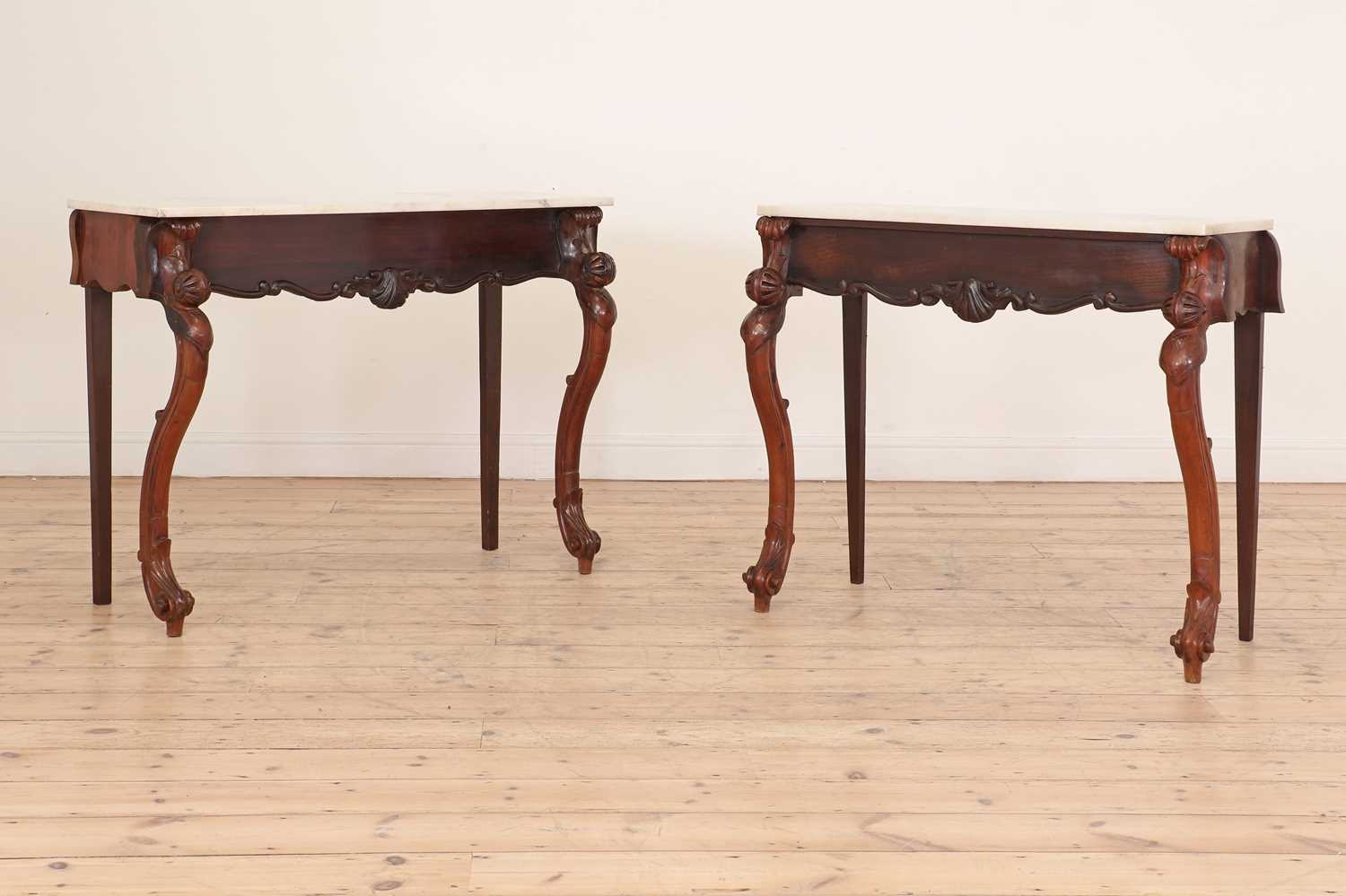 A pair of mahogany and rosewood console tables,