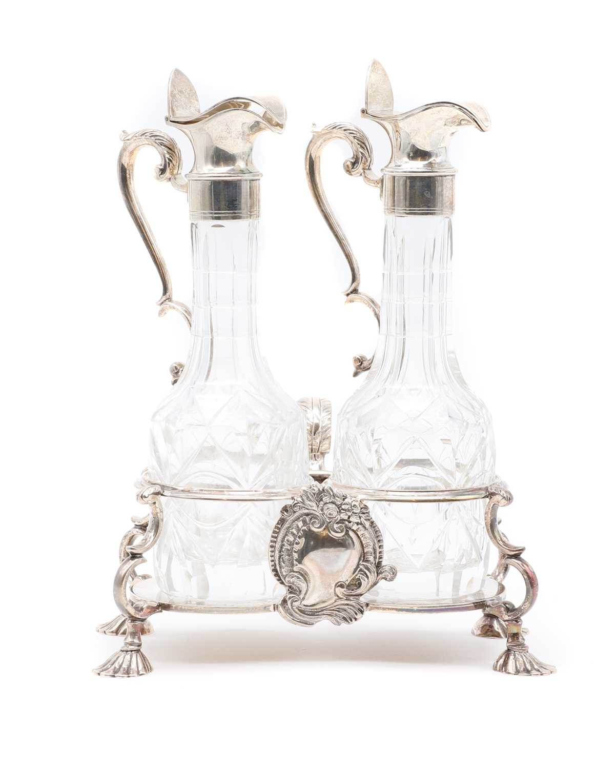 A silver twin bottle cruet stand