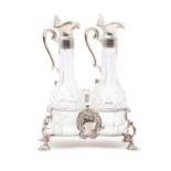 A silver twin bottle cruet stand