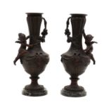 A pair of Classical style spelter vases