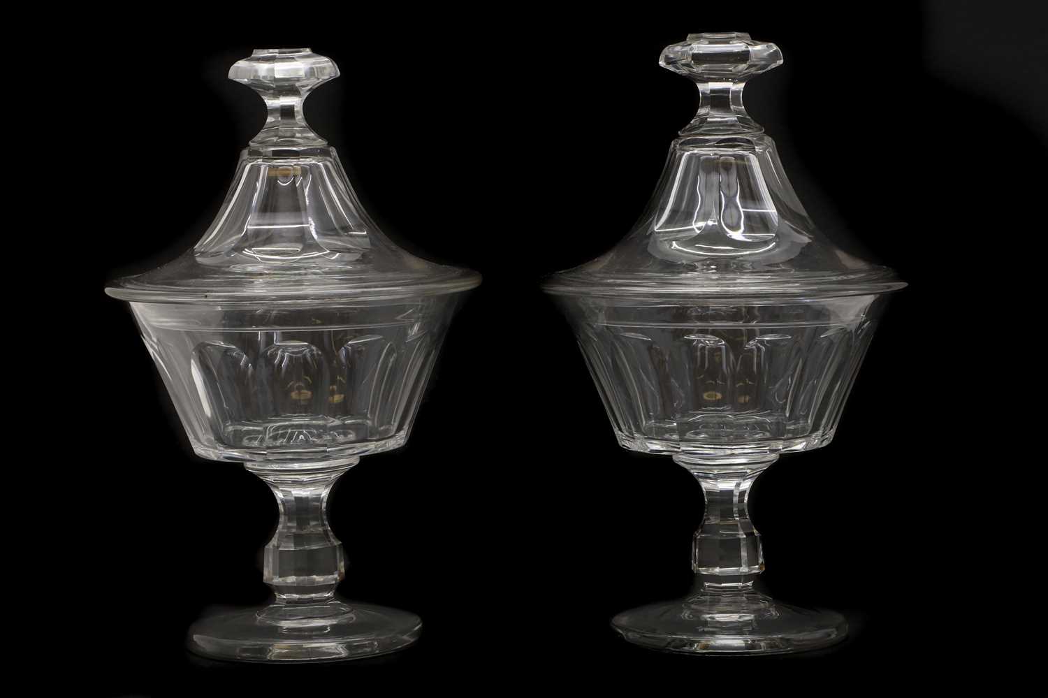 A pair of Victorian cut glass pedestal vases and covers,