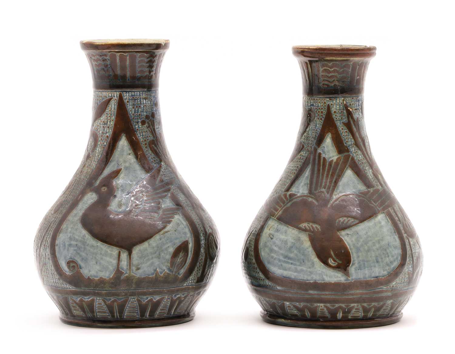 A pair of C H Brannam 'Barum ware' pottery vases