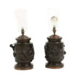 A pair of Japanese patinated bronze table lamps