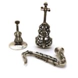 A collection of novelty silver instruments,