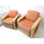 A large pair of conservatory-style wickerwork armchairs with cushions (88cm wide) (2)