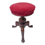 A good mid 19th century circular topped adjustable rosewood music/piano stool; bulbous gadrooned