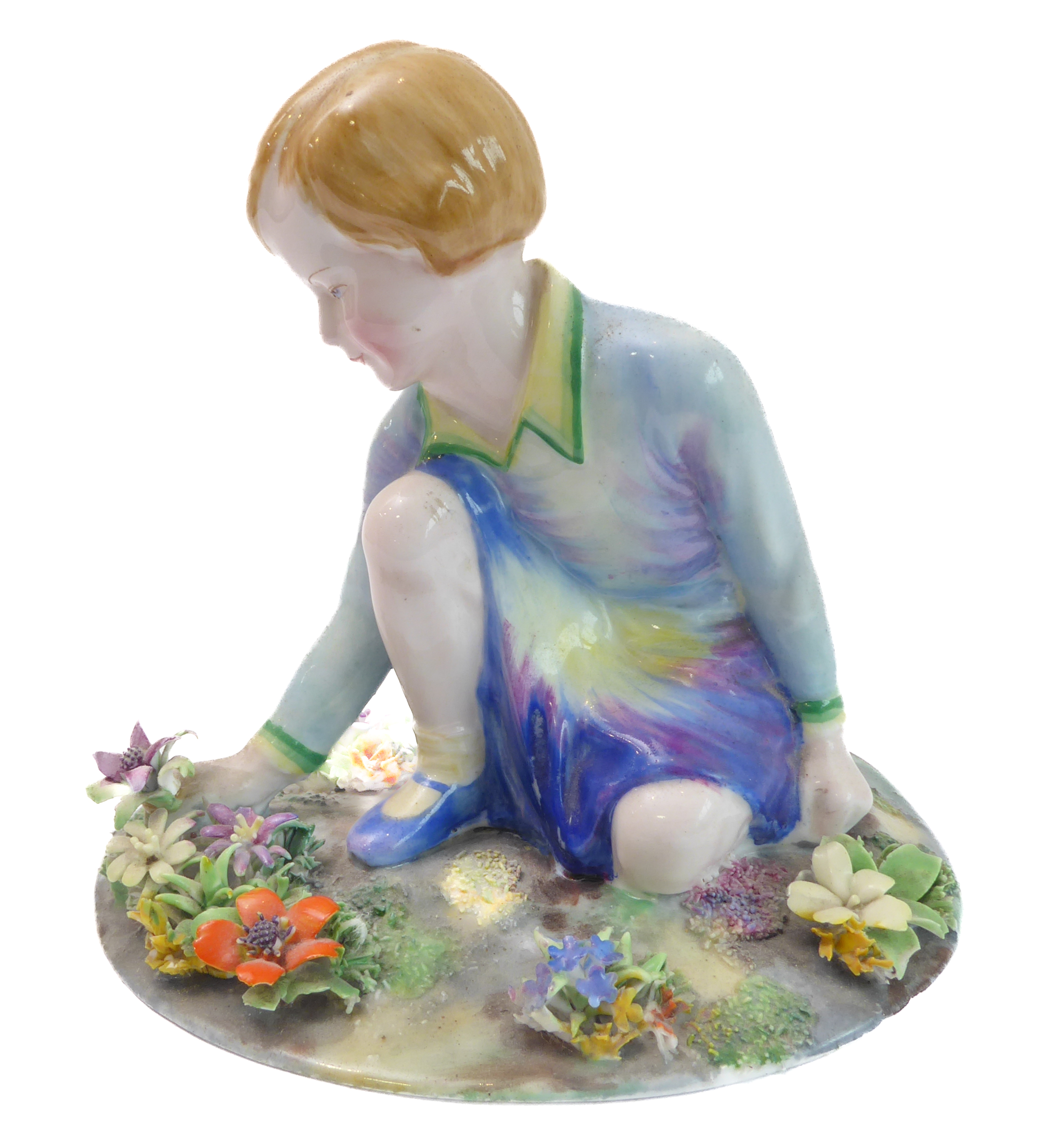 A circa 1930s Crown Staffordshire porcelain model of a young girl picking flowers