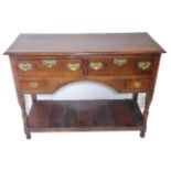 An antique oak dresser of small and pleasing proportions; the thumbnail moulded top above two half-
