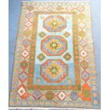 A large hand-knotted multi-coloured 100% woollen pile Turkish carpet – octagonal gul pattern against