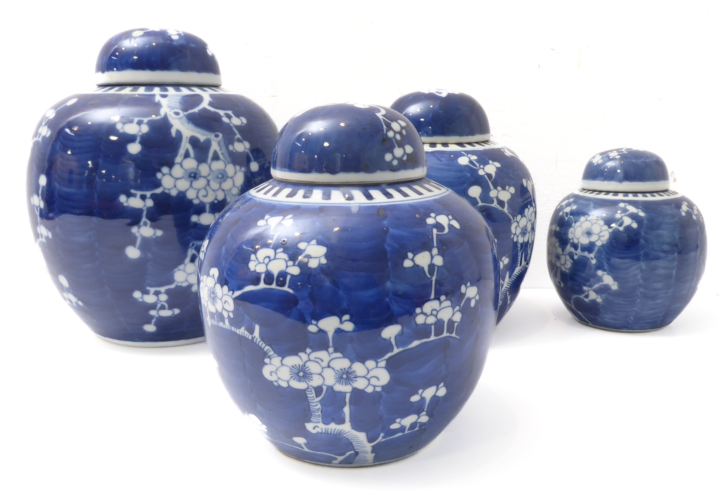 Four Chinese ginger jars and covers – varying sizes, decorated in underglaze blue and white with
