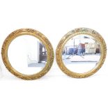 A good pair of 19th century style (later) circular gilt-framed wall-hanging looking glasses –  the