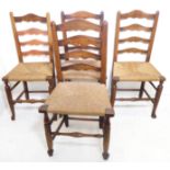 Four late 18th/early 19th century George III period ash ladderback chairs having rush seats and