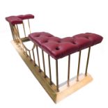 A good modern red-leather-upholstered brass club fender (internal dimensions approx. 42 x 154cm,