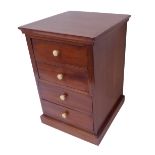 An Edwardian mahogany miniature chest of four full-width drawers, raised on plinth base (25.5cm wide
