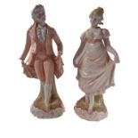 A pair of porcelain figures of a lady and gentleman