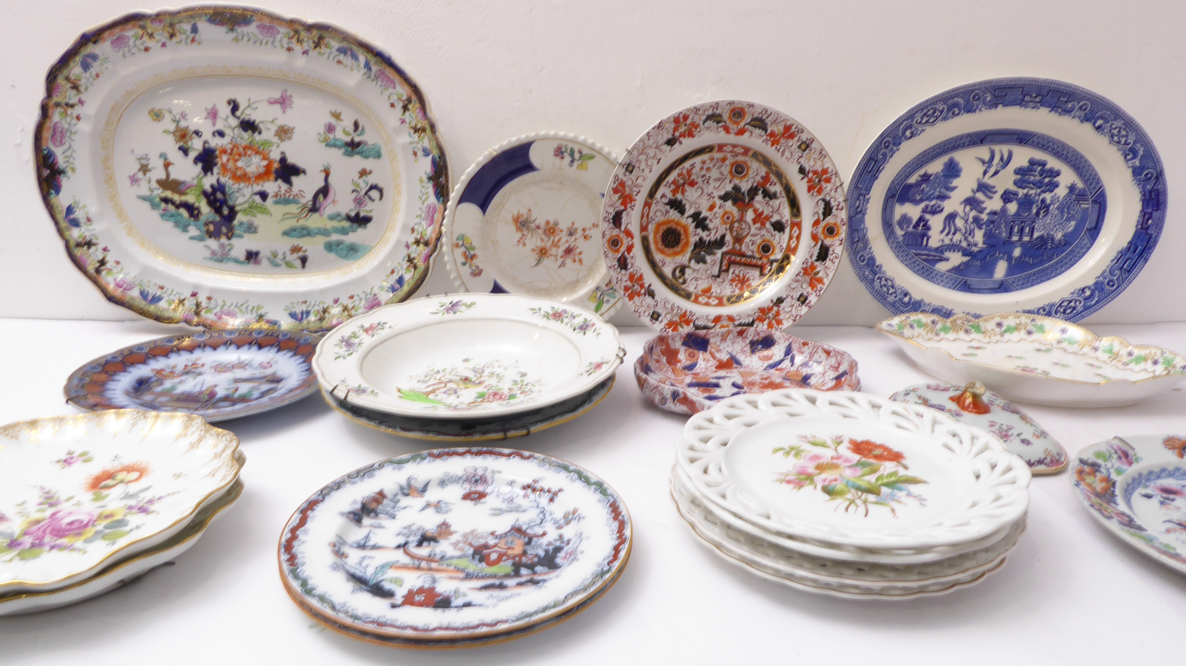 A selection of mostly 19th century decorative plates, bowls and porcelain dishes to include