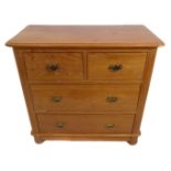 An early 20th century bleached oak chest; thumbnail moulded top above two half-width and two full-