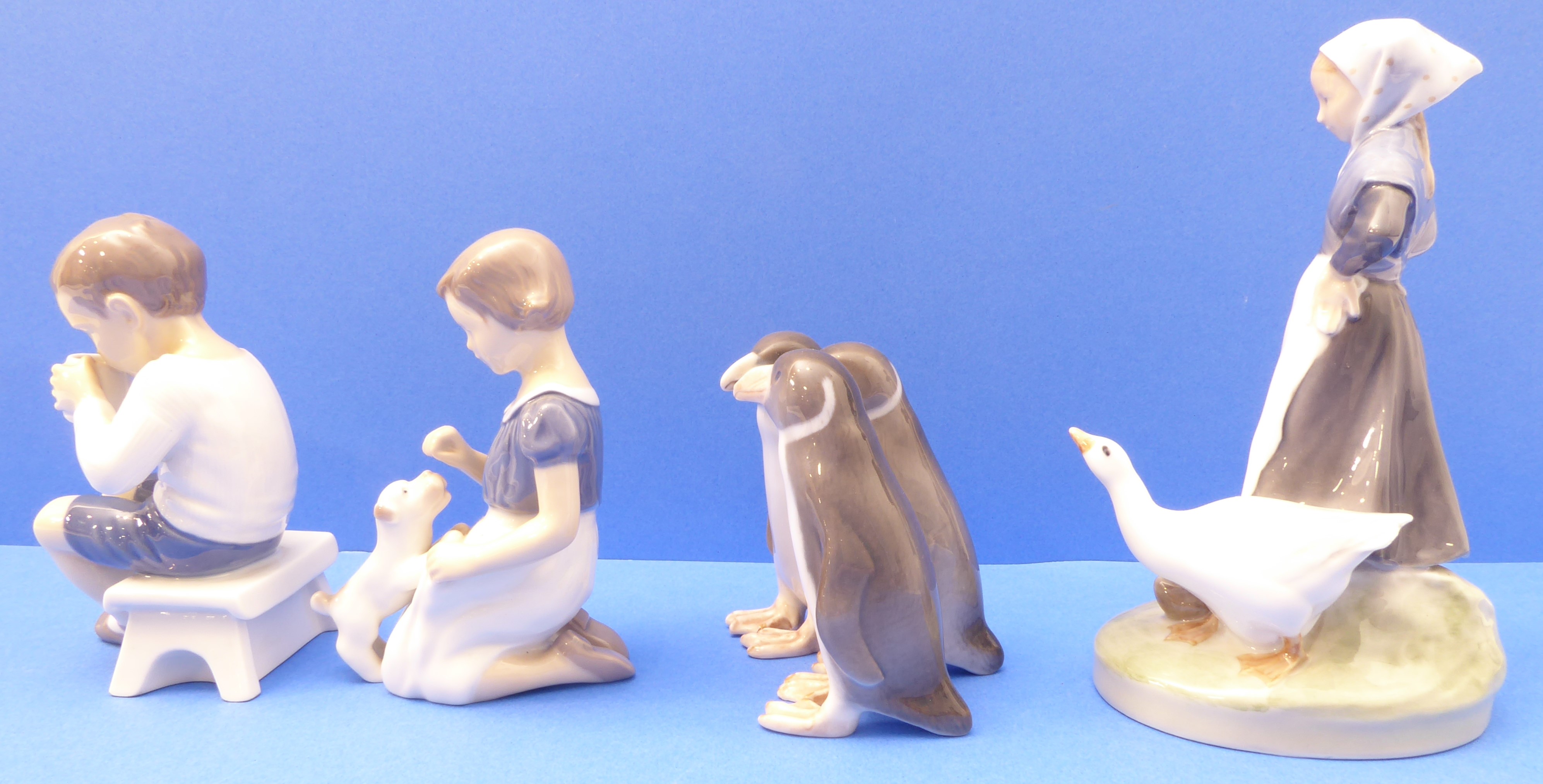 Four mid-20th century Royal Copenhagen porcelain figures (Danish factory): a young girl with - Image 3 of 7