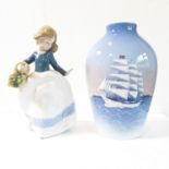 A Royal Copenhagen vase decorated with a sailing ship and a Nau porcelain figurine of a girl with