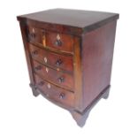 A mid-19th century bow-fronted miniature mahogany table chest in apprentice style – two half-width