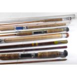 Five freshwater rods, three in sleeves: a Mostyn James 'Light Caster' 2-piece split-cane rod an