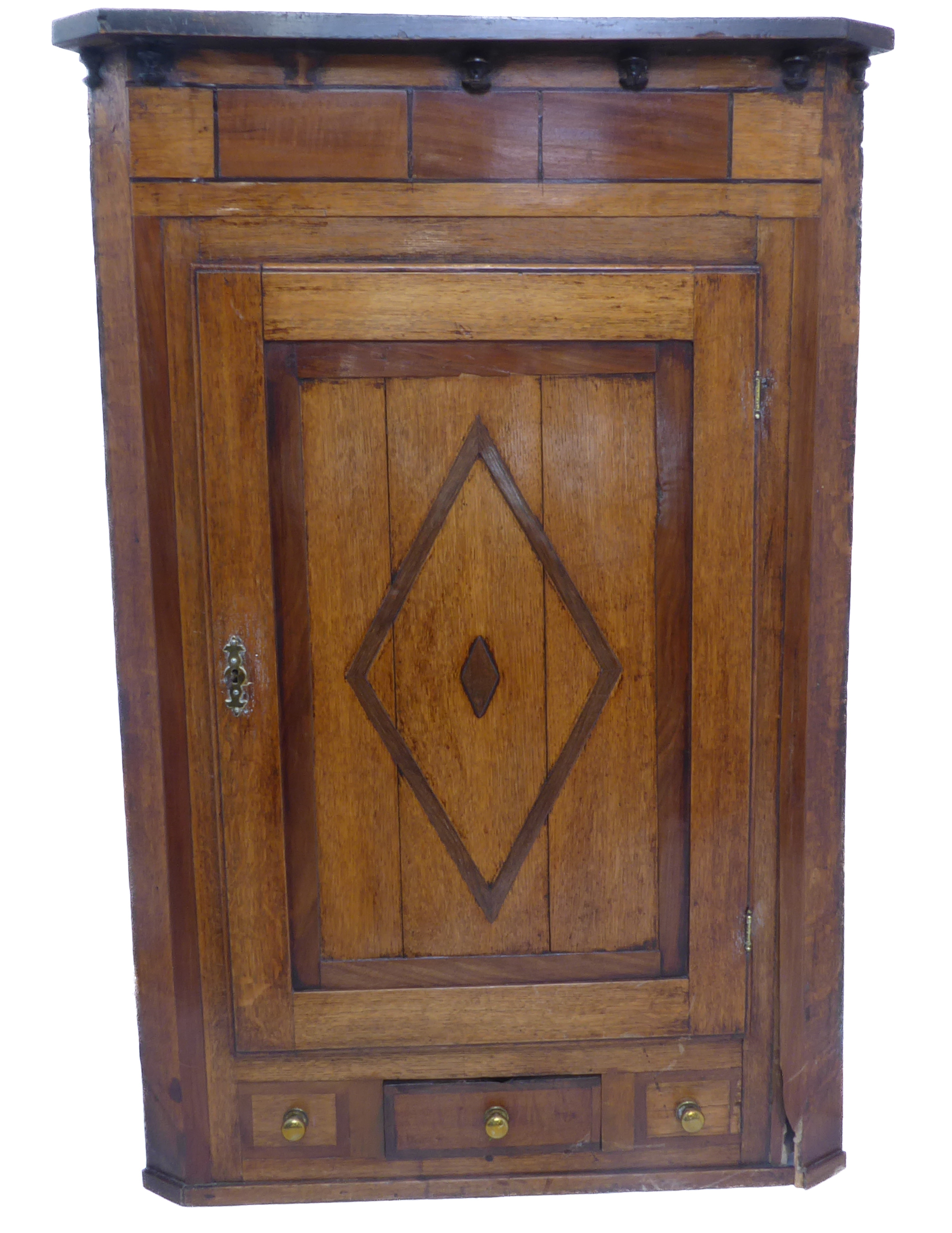 A late 18th century George III period oak and banded hanging corner cupboard; the panelled door