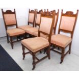 A set of six Edwardian carved oak salon chairs – the turned front legs with castors