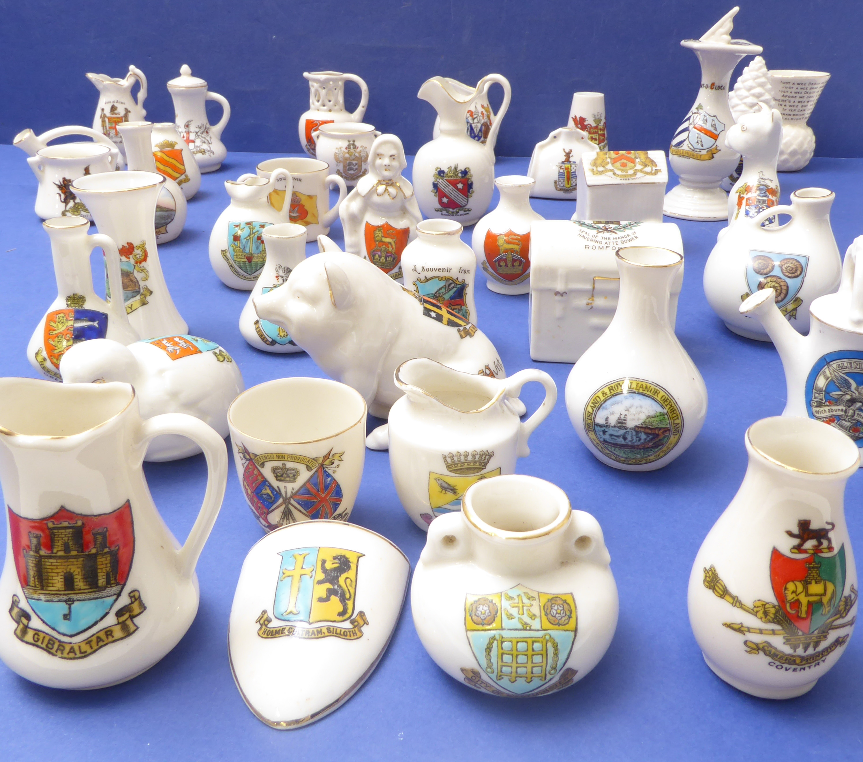 Approximately 39 pieces of porcelain crestware to include WH Goss, Grafton China, Victoria China and