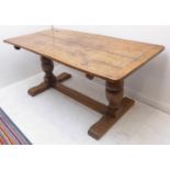 A good 16th/17th century style (later) oak refectory table of good colour; the planked top with