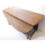 A good and large oak dropleaf gateleg table - in late 17th century style (later) and with oval