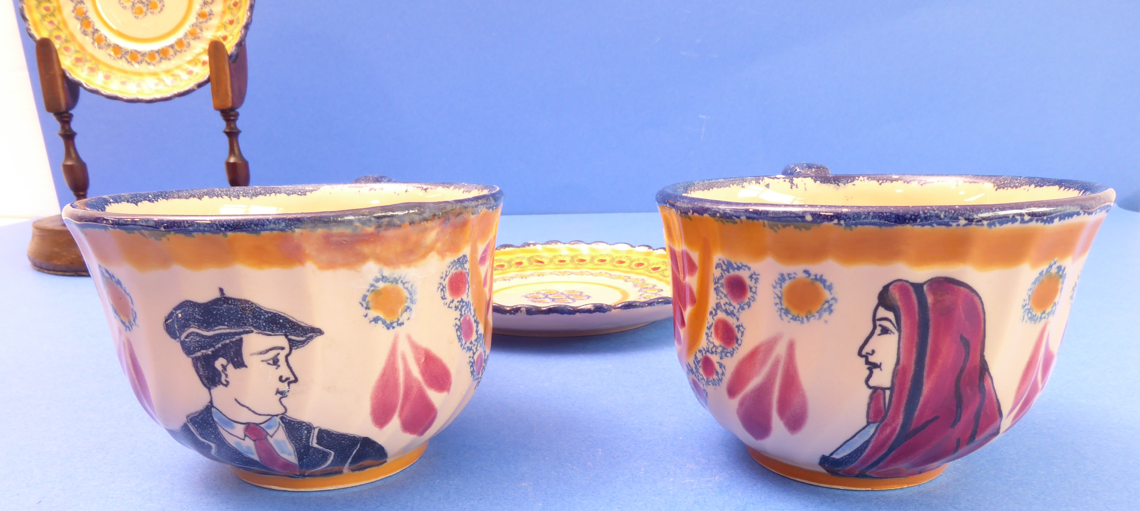 A pair of 1930s French Art Deco cups and saucers signed Luchon; one cup with male figure wearing a - Image 3 of 4