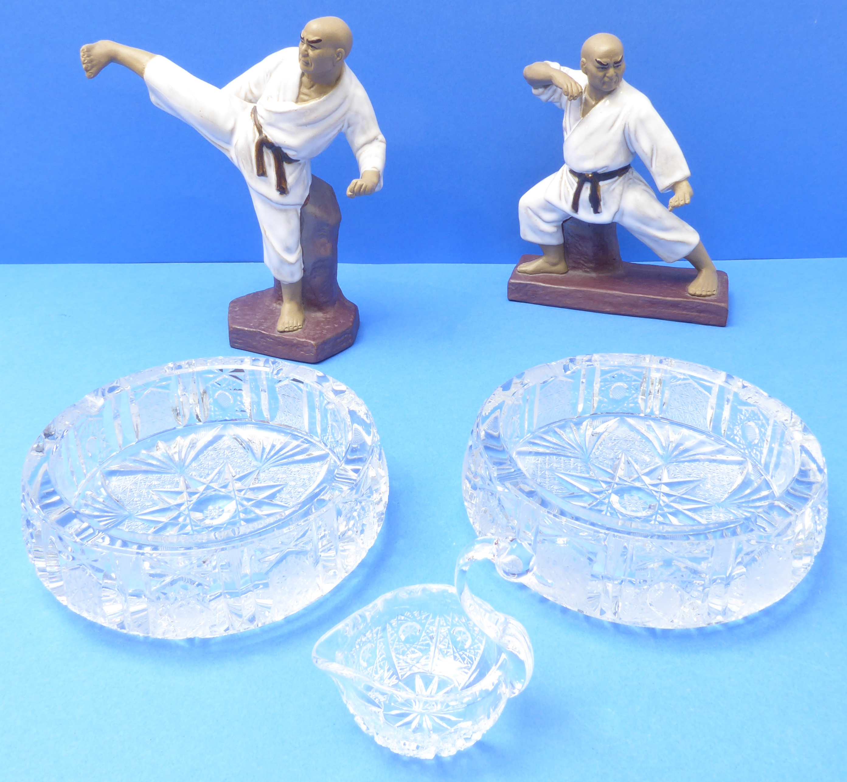 Two Bohemian cut-glass ash trays and a cut-glass swan trinket dish. Together with two hand-decorated