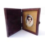 A 19th century portrait miniature of a young lady, in original hinged caseCondition not good,