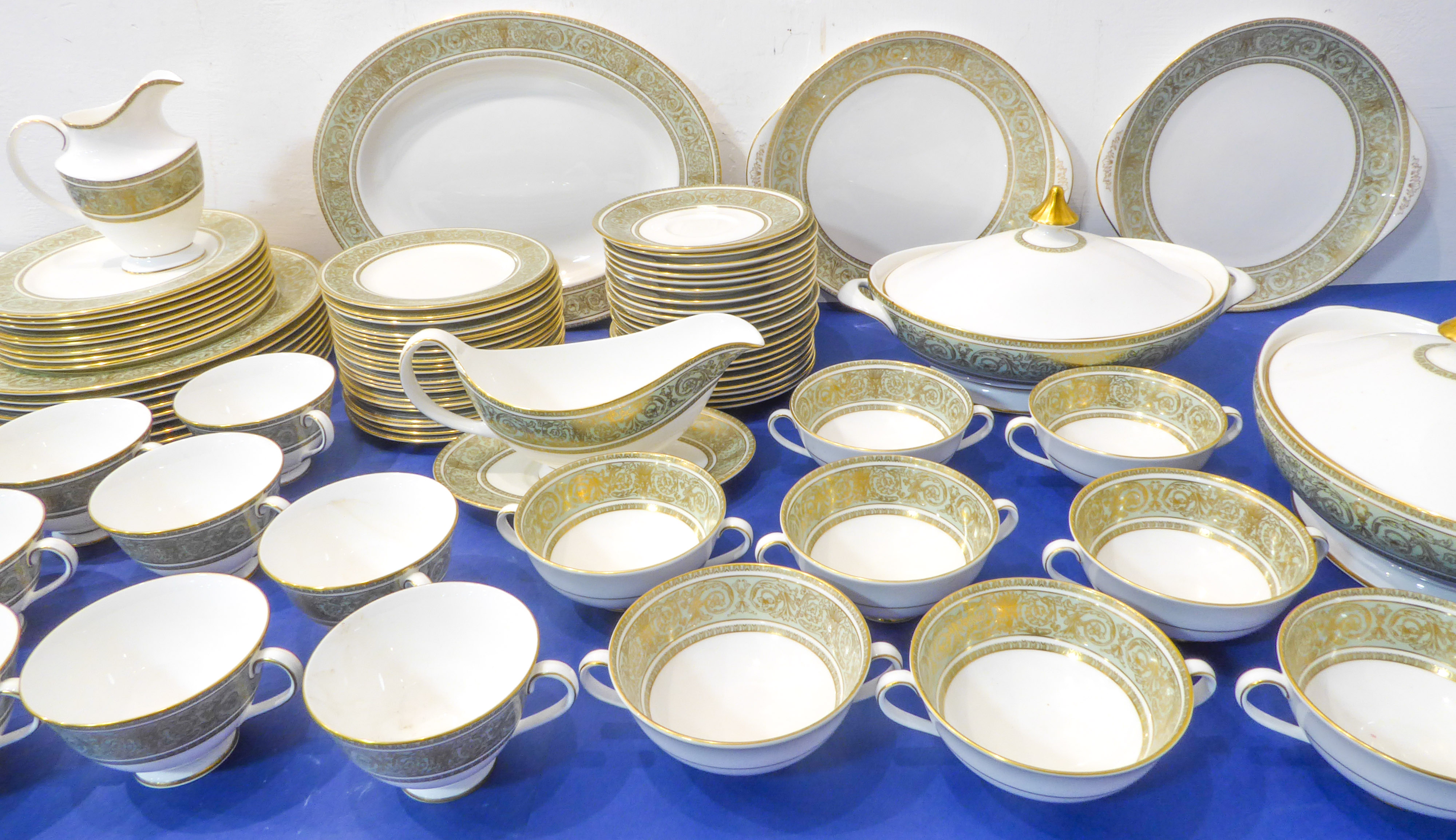 A Royal Doulton dinner / tea service in the English Renaissance pattern: 8 x 27cm and 20cm plates,