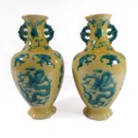 A pair of 20th century ornate hand-painted Chinese vases