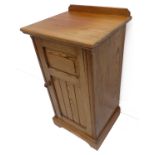 A late 19th/early 20th century Oregon pine bedside-style pot cupboard; the top with short gallery