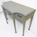 An early 20th century later painted Sheraton-style side table; the breakfront with single central