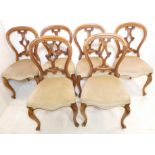 A good set of six mid-19th century walnut balloon-back chairs –  ornately carved pierced splat,