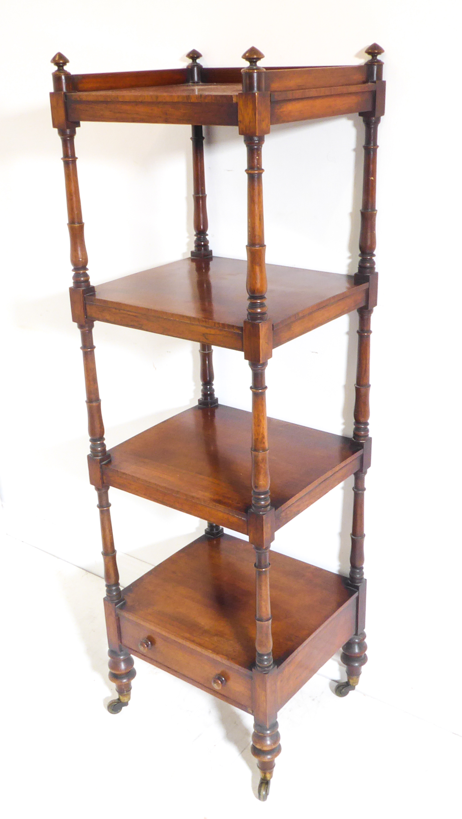 A good late Regency-period four-tier rosewood whatnot – turned uprights, single base drawer and on