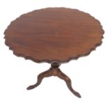 A Georgian-style (later) pie crust edge tilt top mahogany occasional table on tripod base
