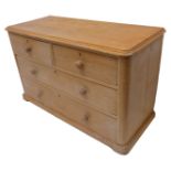 A 19th century pine chest of low proportions; thumbnail moulded top above two half-width and two