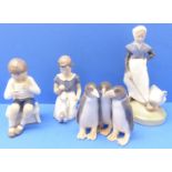 Four mid-20th century Royal Copenhagen porcelain figures (Danish factory): a young girl with