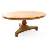 A large early Victorian (circa 1840) circular tilt-top oak breakfast table; gadrooned pear-shaped